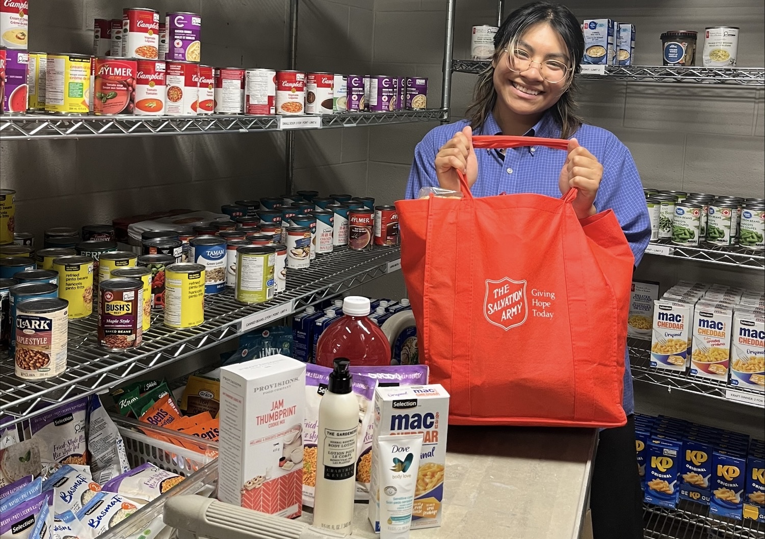 Food bank volunteer prepares items for vulnerable people